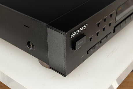 Front left corner of a used Sony ST-S570ES FM/AM Tuner in a black finish