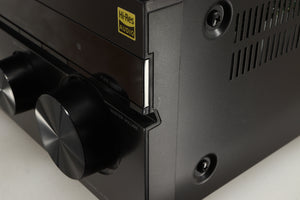 Close up of a used Sony STR-DN1080 AV Receiver in a black finish showing some scratching on font right corner