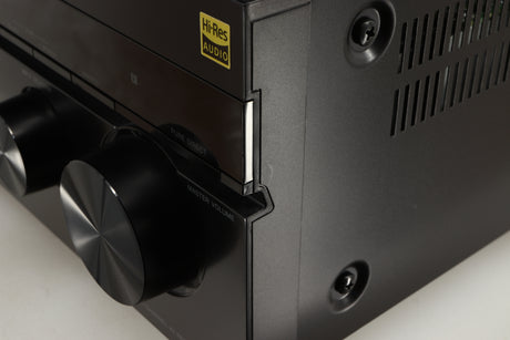 Close up of a used Sony STR-DN1080 AV Receiver in a black finish showing some scratching on font right corner