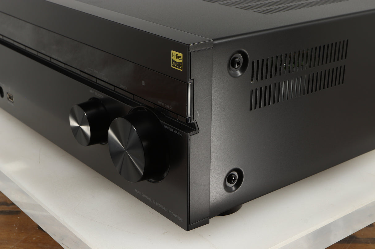 Front right corner of a used Sony STR-DN1080 AV Receiver in a black finish