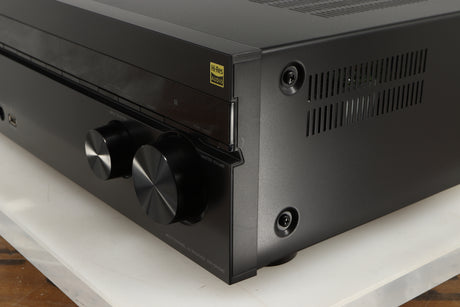 Front right corner of a used Sony STR-DN1080 AV Receiver in a black finish