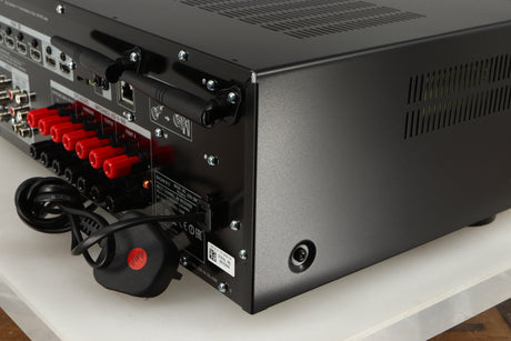 Rear left corner of a used Sony STR-DN1080 AV Receiver in a black finish