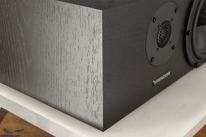 Front left corner of a used Spendor AC2 Centre Speaker in a black oak finish