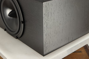 Front right corner of a used Spendor AC2 Centre Speaker in a black oak finish