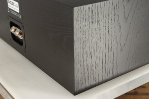 Rear left corner of a used Spendor AC2 Centre Speaker in a black oak finish