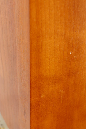 Close up of a used Spendor S8e Floorstanding Speaker in a cherry finish showing few nicks on left side