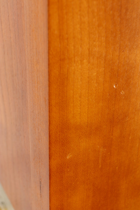 Close up of a used Spendor S8e Floorstanding Speaker in a cherry finish showing few nicks on left side