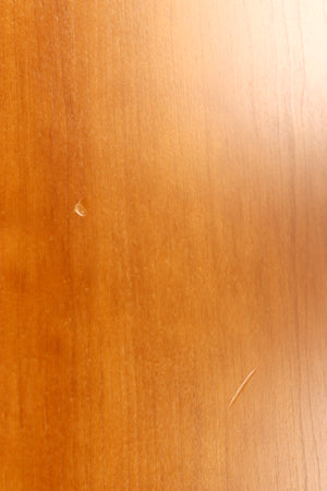 Close up of a used Spendor S8e Floorstanding Speaker in a cherry finish showing few nicks on left side