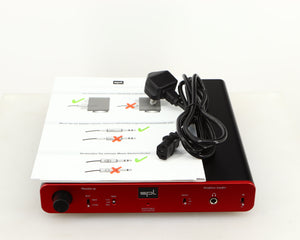 Top of a used SPL Phonitor SE Headphone Amplifier in a red finish showing Manual and Mains Cable