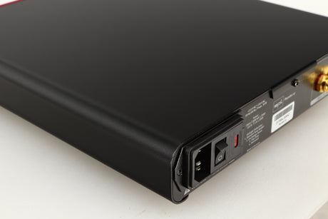 Rear right corner of a used SPL Phonitor SE Headphone Amplifier in a red finish