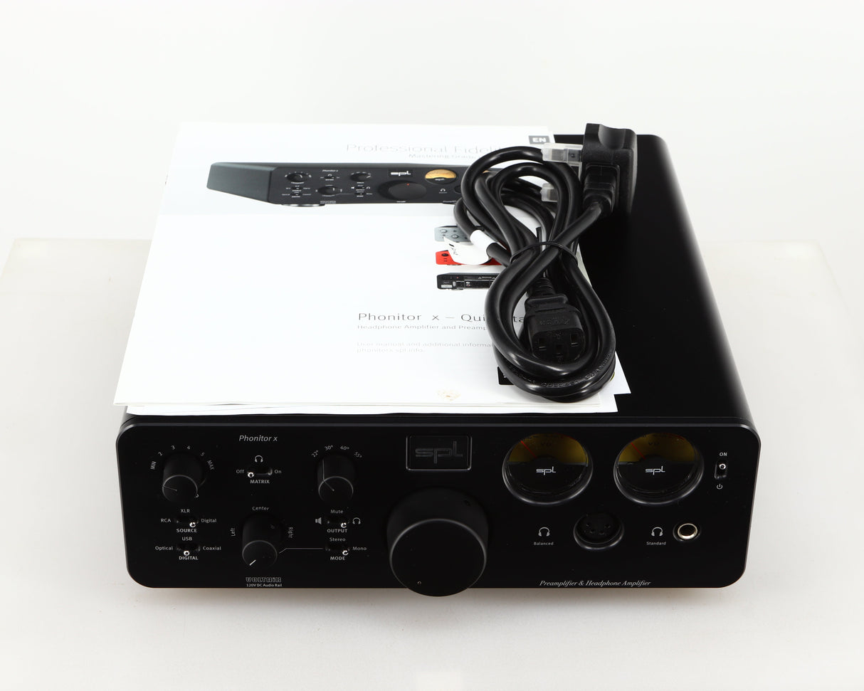 Top of a used SPL Phonitor X Headphone Amplifier & Pre Amplifier W/ DAC in a black finish showing Manual and Mains Cable