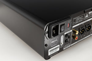 Rear right corner of a used SPL Phonitor X Headphone Amplifier & Pre Amplifier W/ DAC in a black finish