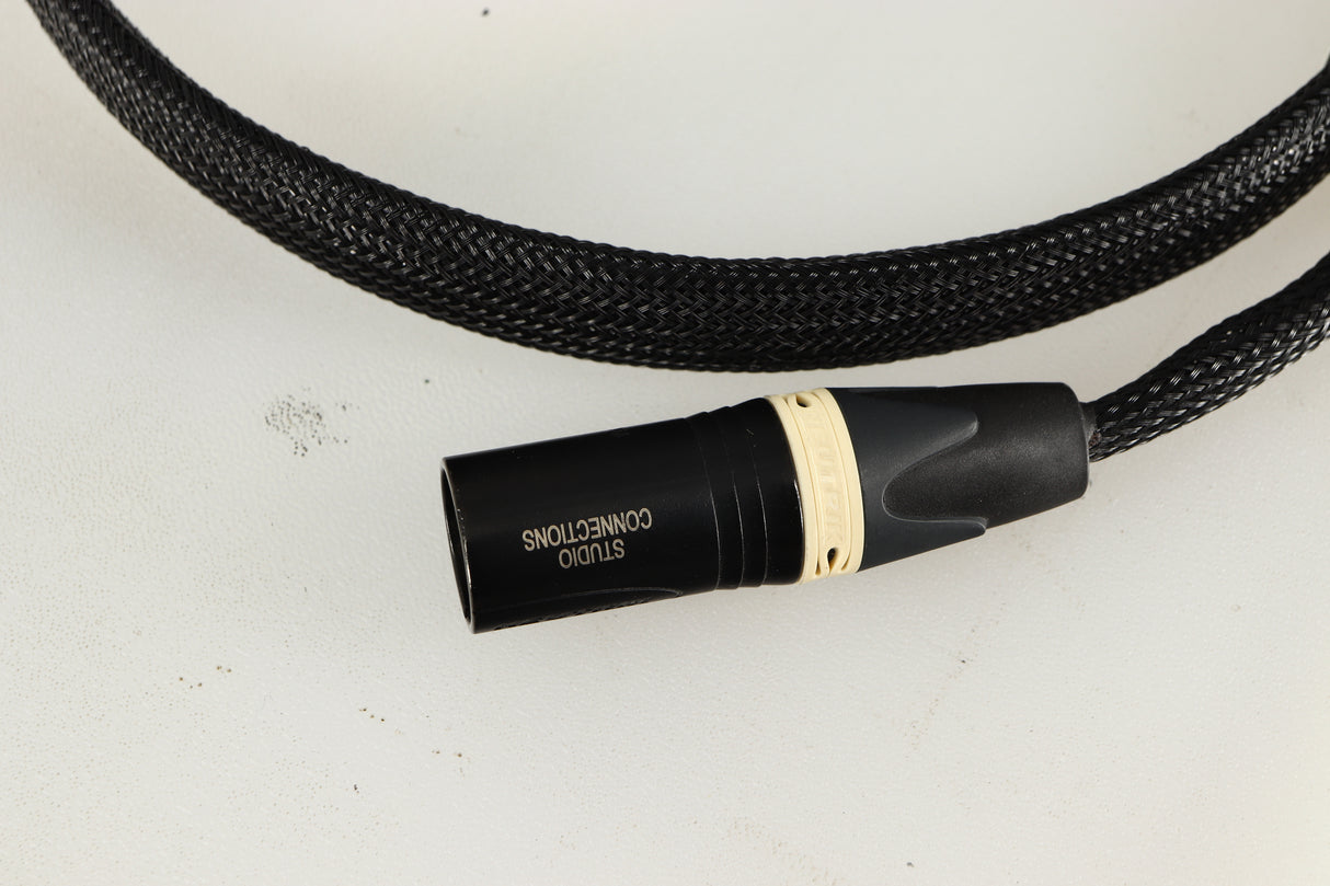 Close up of used Studio Connections Black Star XLR-XLR Interconnect Cables 1.0m Pair in a black finish showing connector