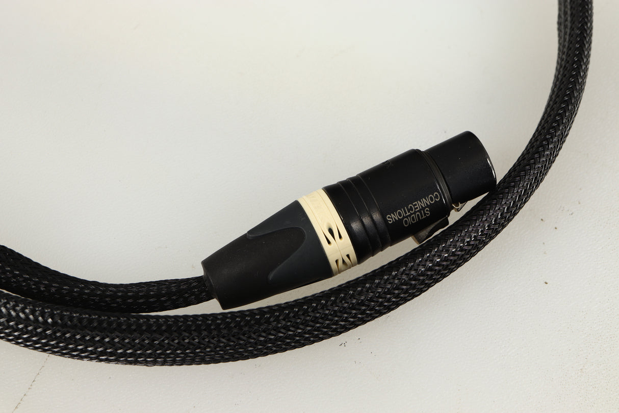 Close up of used Studio Connections Black Star XLR-XLR Interconnect Cables 1.0m Pair in a black finish showing connector