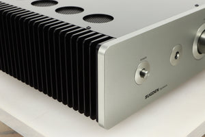 Front left corner view of a used Sugden A21 SE Signature Integrated Amplifier in Titanium finish