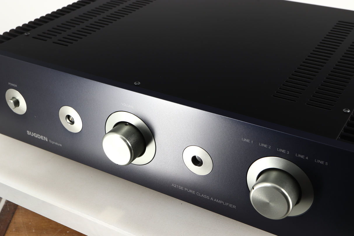 Close up of a used Sugden A21SE Signature Integrated Amplifier in a graphite finish showing some of the fascia
