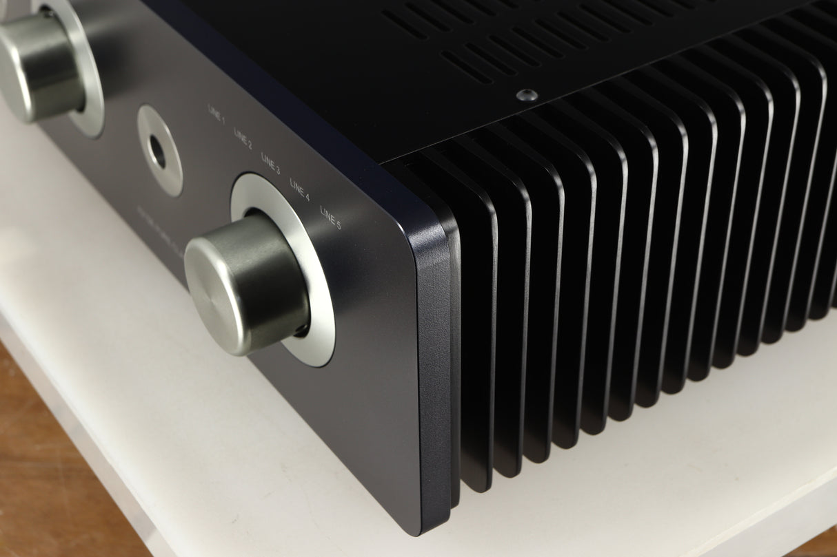 Front right corner of a used Sugden A21SE Signature Integrated Amplifier in a graphite finish