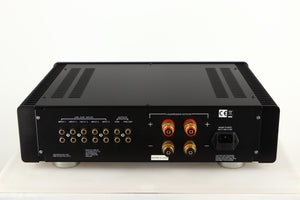 Rear view of a used Sugden A21SE Signature Integrated Amplifier in a graphite finish showing Phono Inputs, Phono Outputs, Speaker Outputs and Mains Input