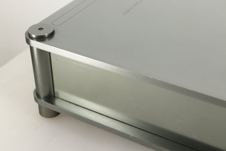 Close up of a used Sugden Bijou Ampmaster Power Amplifier in a silver finish showing scratch on right side