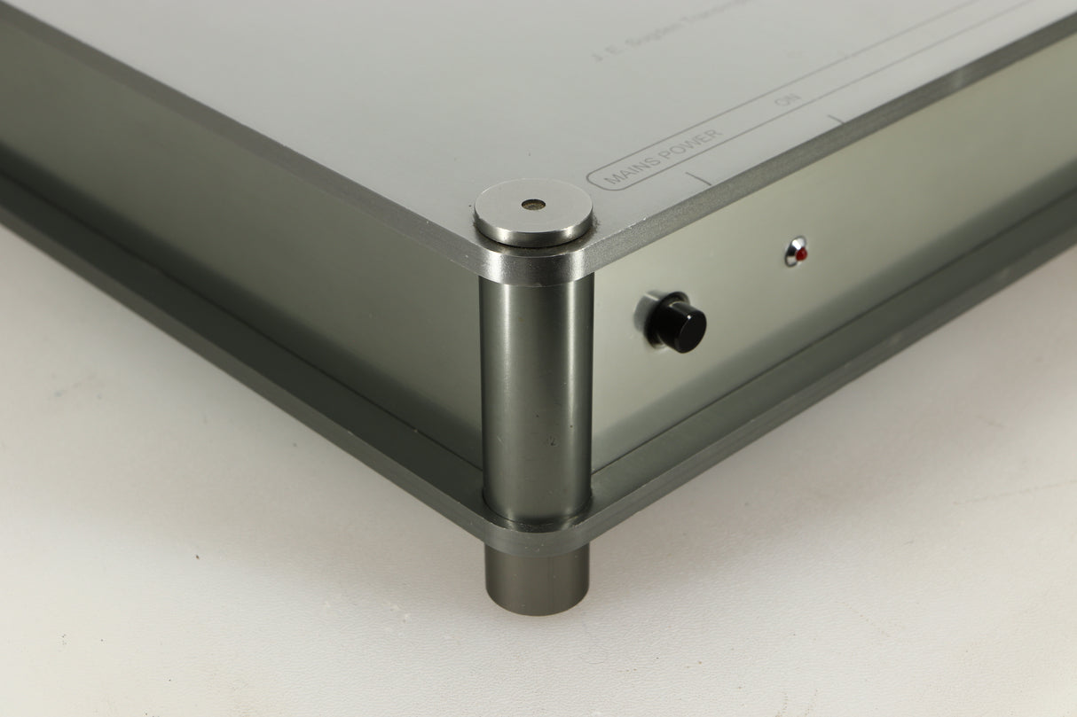 Front left corner of a used Sugden Bijou Ampmaster Power Amplifier in a silver finish