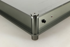 Front left corner of a used Sugden Bijou Ampmaster Power Amplifier in a silver finish