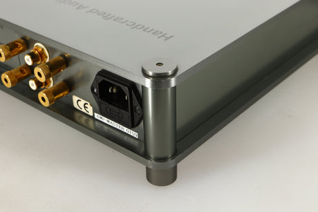 Rear left corner of a used Sugden Bijou Ampmaster Power Amplifier in a silver finish