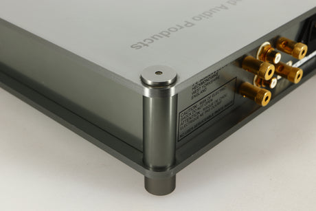 Rear right corner of a used Sugden Bijou Ampmaster Power Amplifier in a silver finish