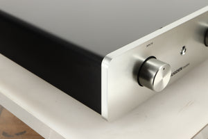 Front left corner view of a used Sugden Mystro Integrated Amplifier in Titanium finish