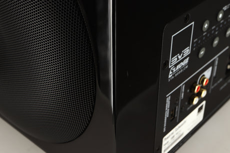 Close up of a used SVS-3000 Micro Subwoofer W/ Wireless Kit in a piano black finish showing small scratch on rear