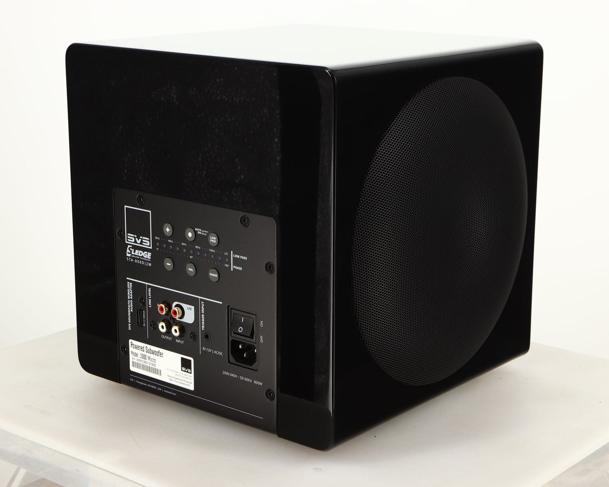 Rear left corner of a used SVS-3000 Micro Subwoofer W/ Wireless Kit in a piano black finish