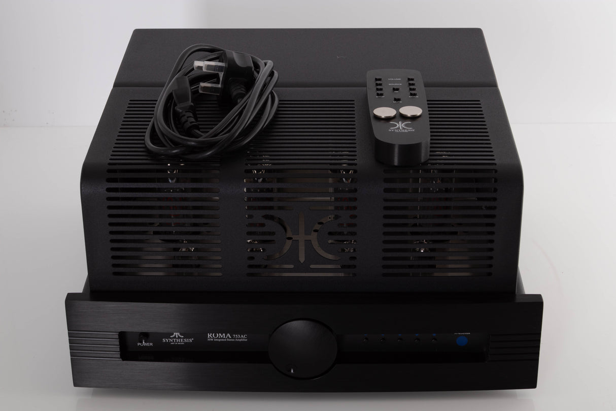 Top of a used Synthesis Roma 753AC Valve Integrated Amplifier in a Black finish showing Remote, Batteries and Mains Cable