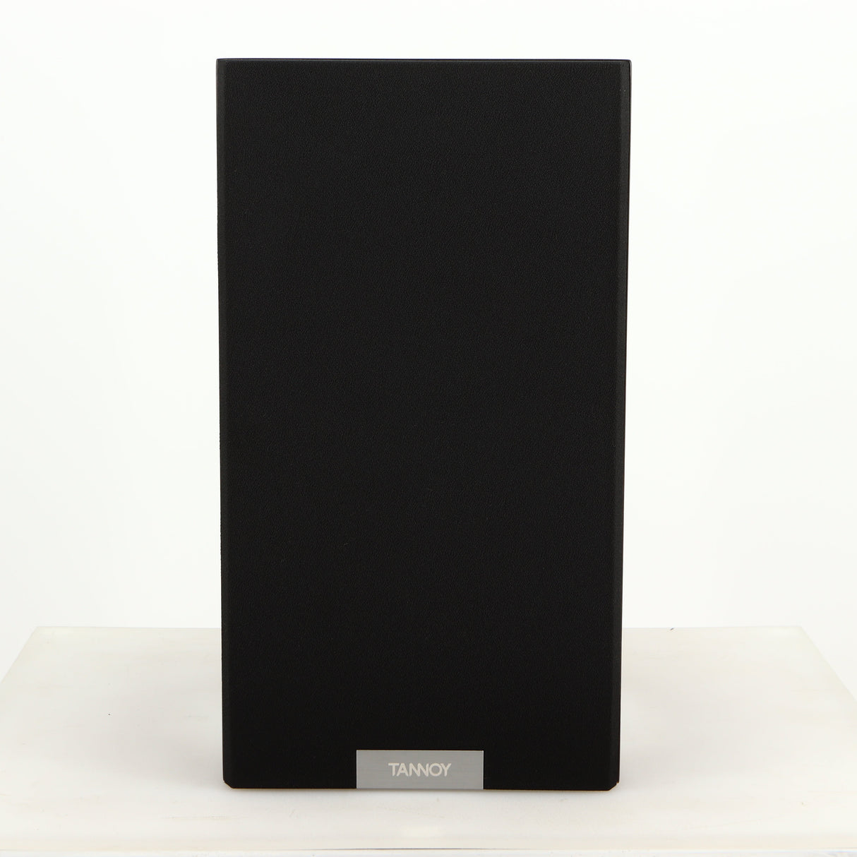 Front view of a used Tannoy Revolution DC6SE Standmount Speaker in an espresso finish showing Grille