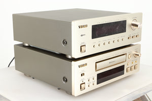 Front left corner of a used Teac T-H500 AM/FM Tuner / R-H500 Stereo Cassette Deck in a silver finish 