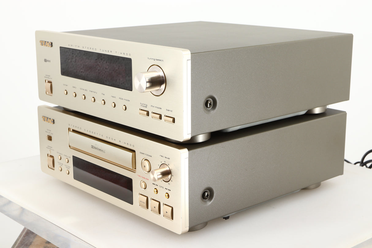 Front right corner of a used Teac T-H500 AM/FM Tuner / R-H500 Stereo Cassette Deck in a silver finish 