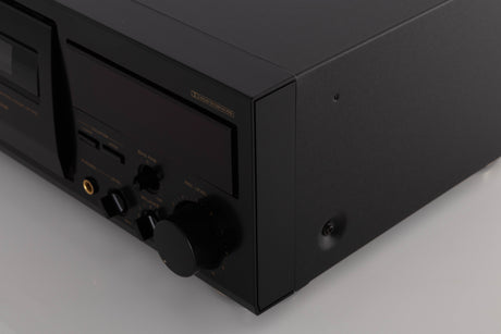 Front right corner of a used TEAC V-1050 Cassette Deck in a Black finish