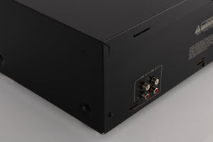 Rear right corner of a used TEAC V-1050 Cassette Deck in a Black finish
