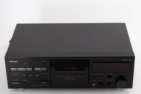 Top of a used TEAC V-1050 Cassette Deck in a Black finish