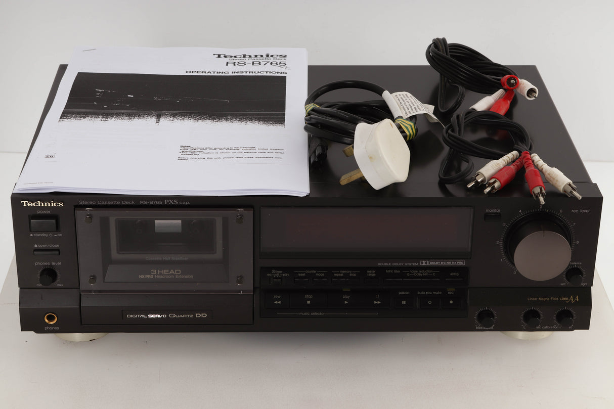 Front view of a used Technics RS-B765 3-Head Cassette Deck with mais cable, manual, and 2x interconnects