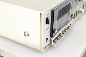 Front left corner of a used Technics RS-M225 Cassette Deck in a silver finish 