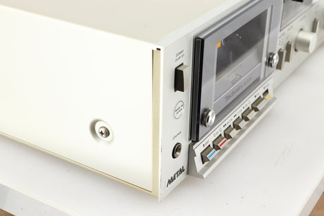 Front left corner of a used Technics RS-M225 Cassette Deck in a silver finish 