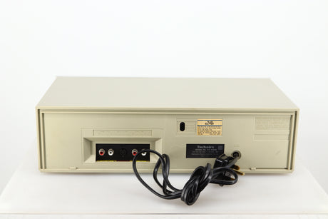 Rear view of a used Technics RS-M225 Cassette Deck in a silver finish showing Phono Inputs and Outputs