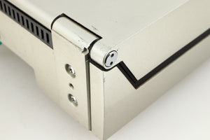Close up of a used Technics SL-10 Turntable in a silver finish showing some damage