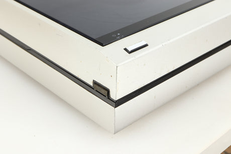 Front left corner of a used Technics SL-10 Turntable in a silver finish