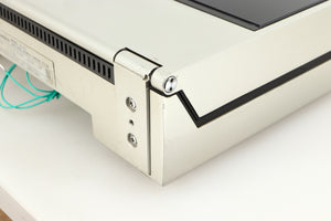Rear left corner of a used Technics SL-10 Turntable in a silver finish