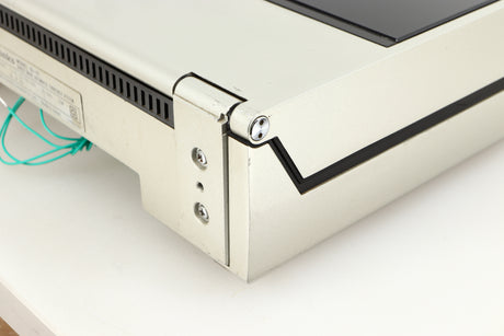 Rear left corner of a used Technics SL-10 Turntable in a silver finish