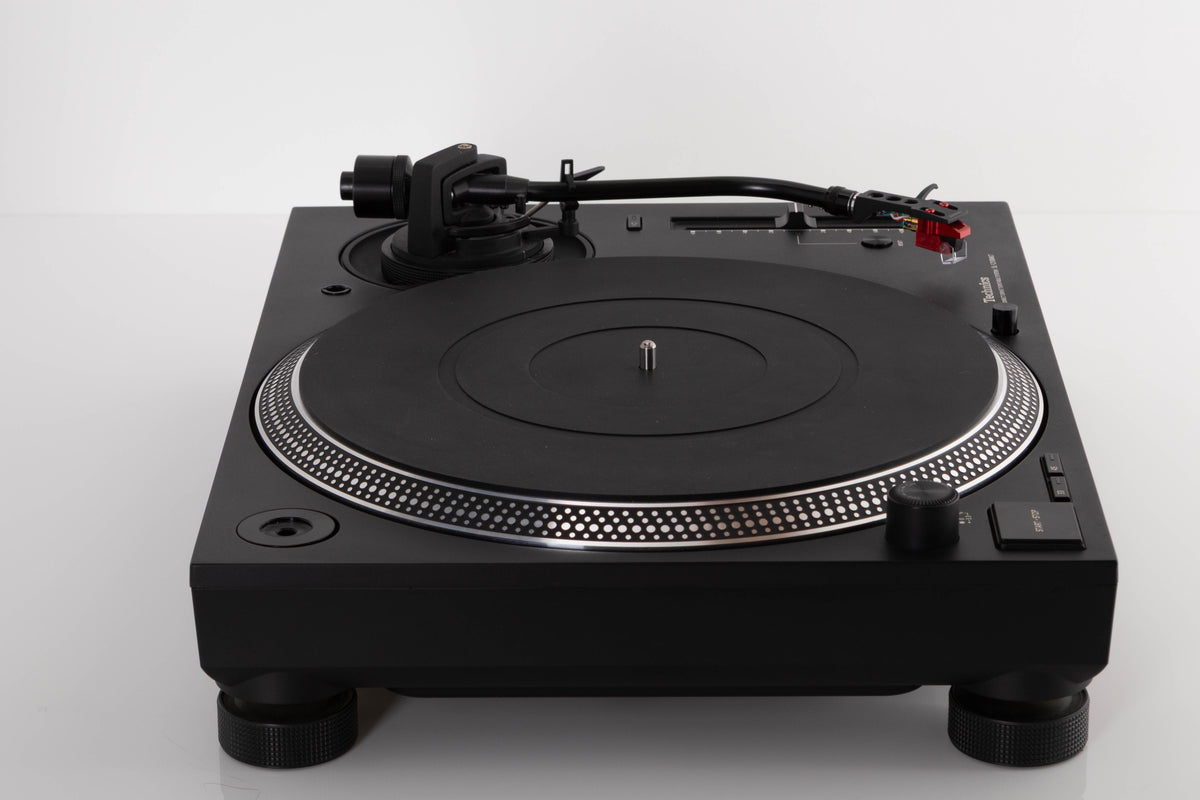 Side view of a used Technics SL-1210 MK7 Turntable with AT-40ML Cartridge