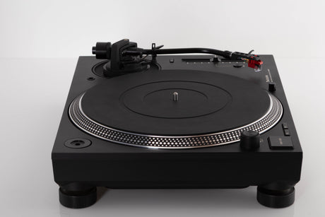 Side view of a used Technics SL-1210 MK7 Turntable with AT-40ML Cartridge