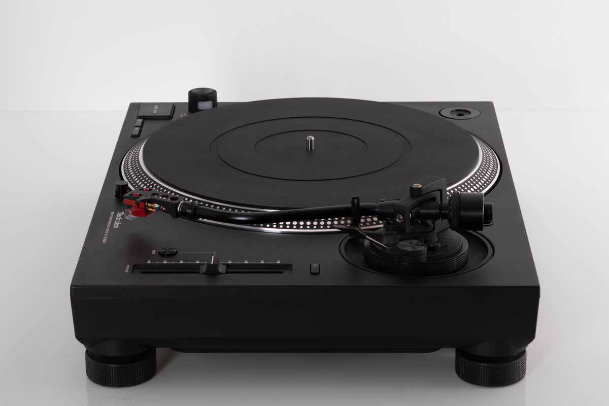 Side view of a used Technics SL-1210 MK7 Turntable with AT-40ML Cartridge