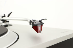 Close up of a used Technics SL-1500C Turntable in a silver finish showing stylus