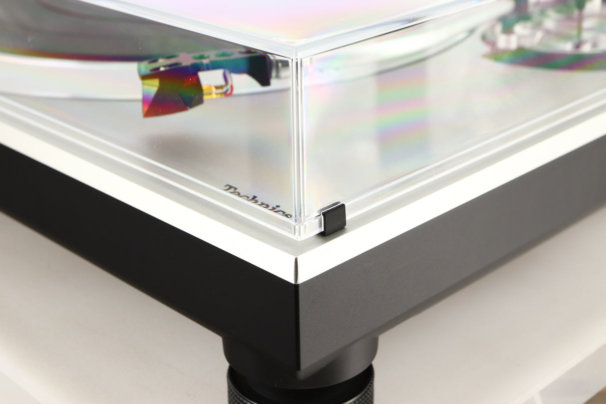 Front right corner of a used Technics SL-1500C Turntable in a silver finish